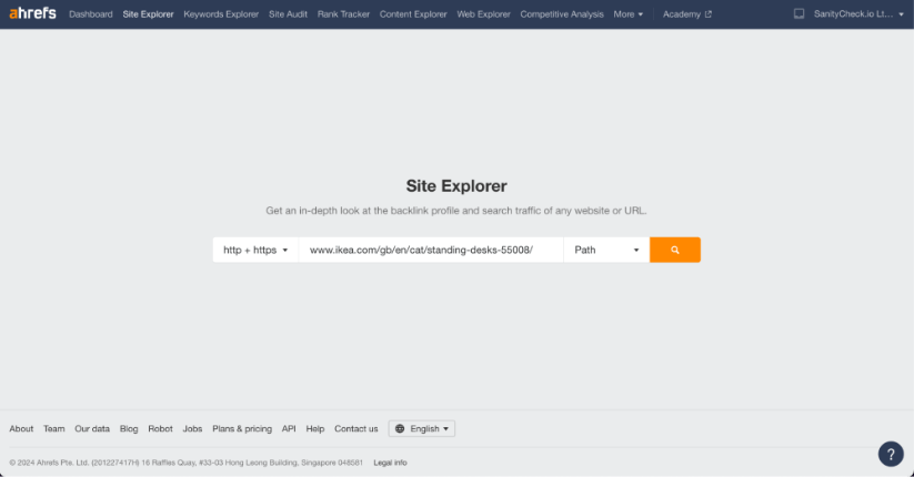 Ahrefs Site Explorer search bar with an IKEA URL for researching sit-stand desks.