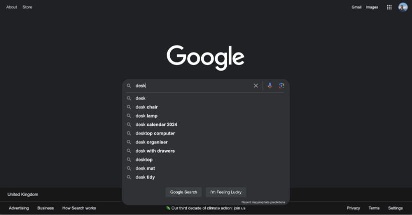 Google search bar with autocomplete suggestions for various desk-related items.
